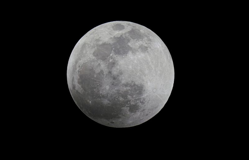 The Moon is seen before the start of a lunar eclipse in Mexico City, Sunday, May 15, 2022. (AP Photo/Fernando Llano)