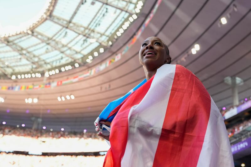Jasmine Camacho-Quinn, of Puerto Rico, smiles after winning the bronze medal in the women's 100 meters hurdles final at the 2024 Summer Olympics, Saturday, Aug. 10, 2024, in Saint-Denis, France. (AP Photo/Ashley Landis)