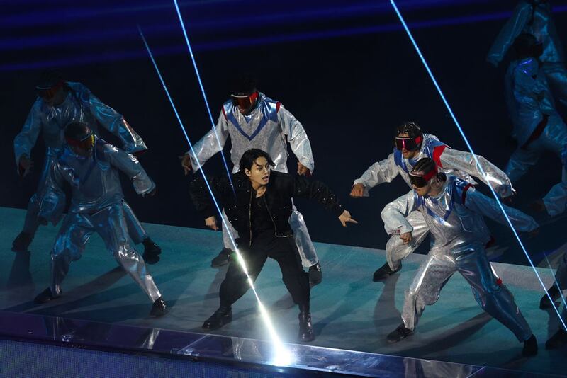 AL KHOR, QATAR - NOVEMBER 20: Jung Kook of BTS performs during the opening ceremony prior to the FIFA World Cup Qatar 2022 Group A match between Qatar and Ecuador at Al Bayt Stadium on November 20, 2022 in Al Khor, Qatar. (Photo by Elsa/Getty Images)