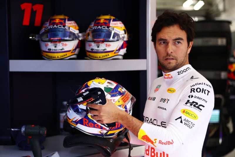 LUSAIL CITY, QATAR - NOVEMBER 30: Sergio Perez of Mexico and Oracle Red Bull Racing prepares to drive in the garage prior to the Sprint ahead of the F1 Grand Prix of Qatar at Lusail International Circuit on November 30, 2024 in Lusail City, Qatar. (Photo by Mark Thompson/Getty Images)