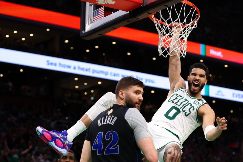 BOSTON, MASSACHUSETTS - JUNE 06: Jayson Tatum #0 of the Boston Celtics reacts as he dunks the ball against Maxi Kleber #42 of the Dallas Mavericks during the second quarter in Game One of the 2024 NBA Finals at TD Garden on June 06, 2024 in Boston, Massachusetts. NOTE TO USER: User expressly acknowledges and agrees that, by downloading and or using this photograph, User is consenting to the terms and conditions of the Getty Images License Agreement. (Photo by Maddie Meyer/Getty Images)