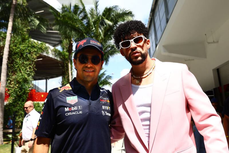 MIAMI, FLORIDA - MAY 08: Sergio Perez of Mexico and Oracle Red Bull Racing poses for a photo in the Paddock with Bad Bunny prior to the F1 Grand Prix of Miami at the Miami International Autodrome on May 08, 2022 in Miami, Florida. (Photo by Mark Thompson/Getty Images)