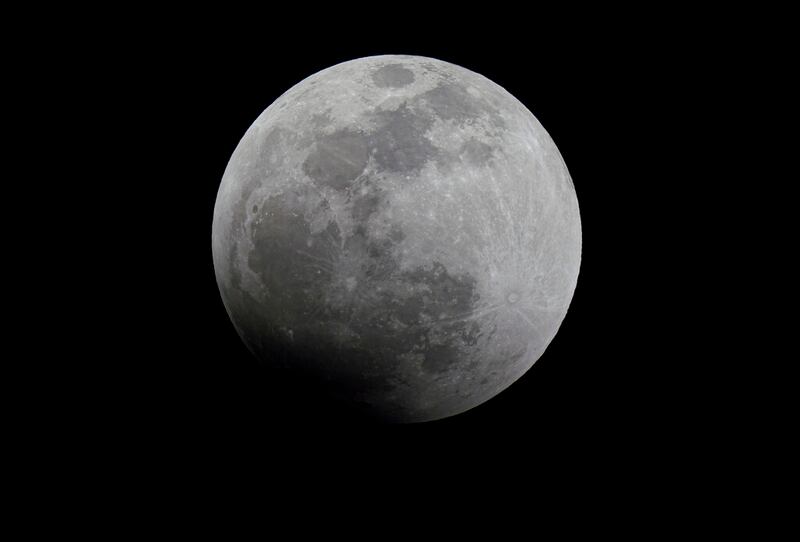 The Moon is seen before the start of a lunar eclipse in Mexico City, Sunday, May 15, 2022. (AP Photo/Fernando Llano)