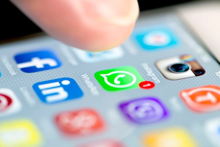 Istanbul, Turkey - September 18, 2015: Apple Iphone 6 screen with social media applications of Whatsapp, Facebook, Instagram, Viber, Linkedin, Tango, Perisfind and Snapchat while a male finger is about to touch on Whatsapp app.
