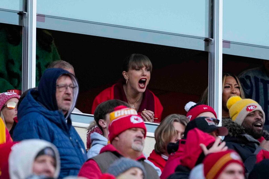 Singer Taylor Swift cheers during the second half of an NFL football game between the Las Vegas Raiders and the Kansas City Chiefs in Kansas City, Mo., Friday, Nov. 29, 2024. (AP Photo/Ed Zurga)