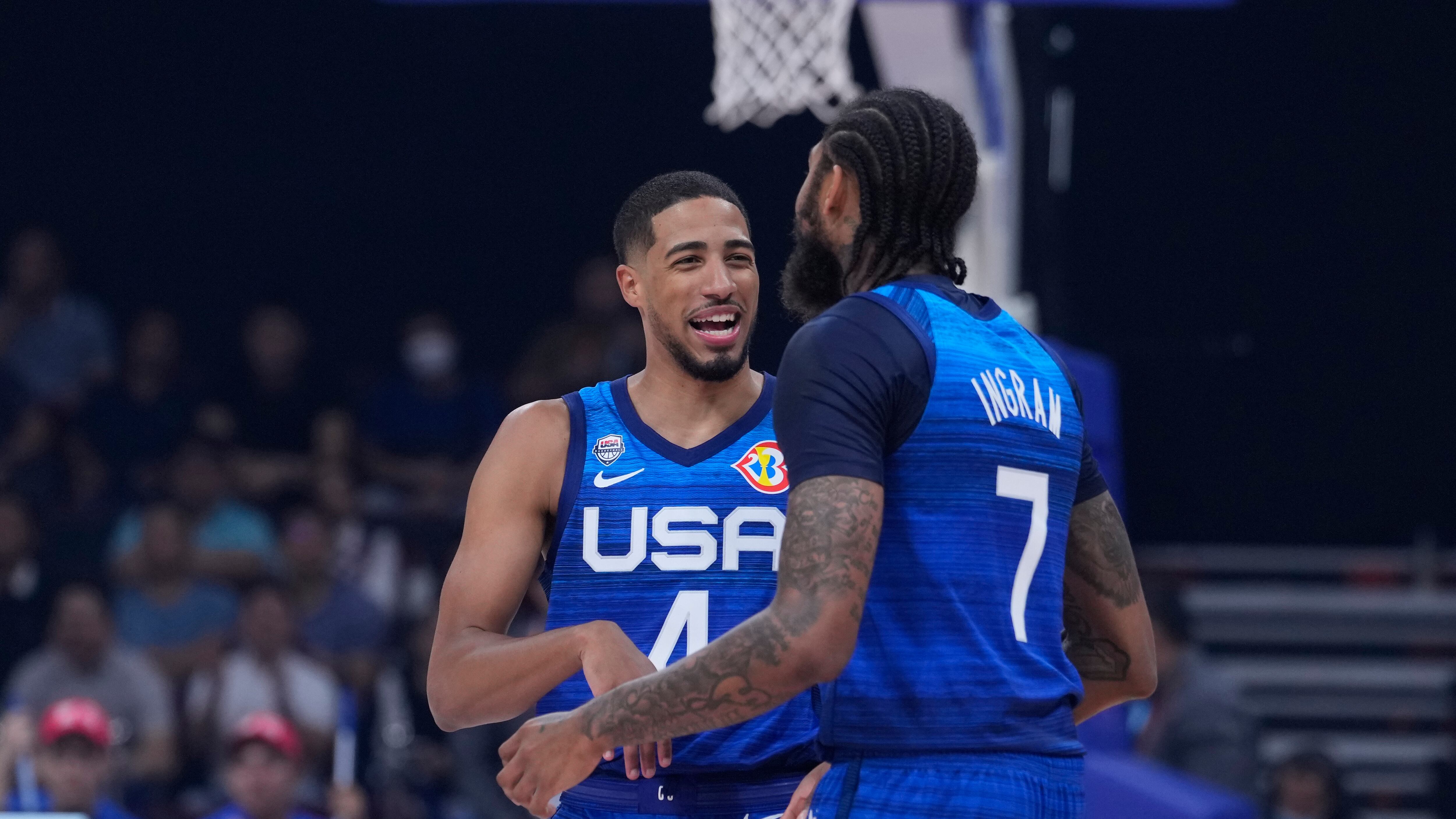 U.S. guard Tyrese Haliburton (4) and U.S. forward Brandon Ingram (7) talk during the Basketball World Cup quarterfinal game between Italy and U.S. at the Mall of Asia Arena in Manila, Philippines, Tuesday Sept. 5, 2023. (AP Photo/Michael Conroy)