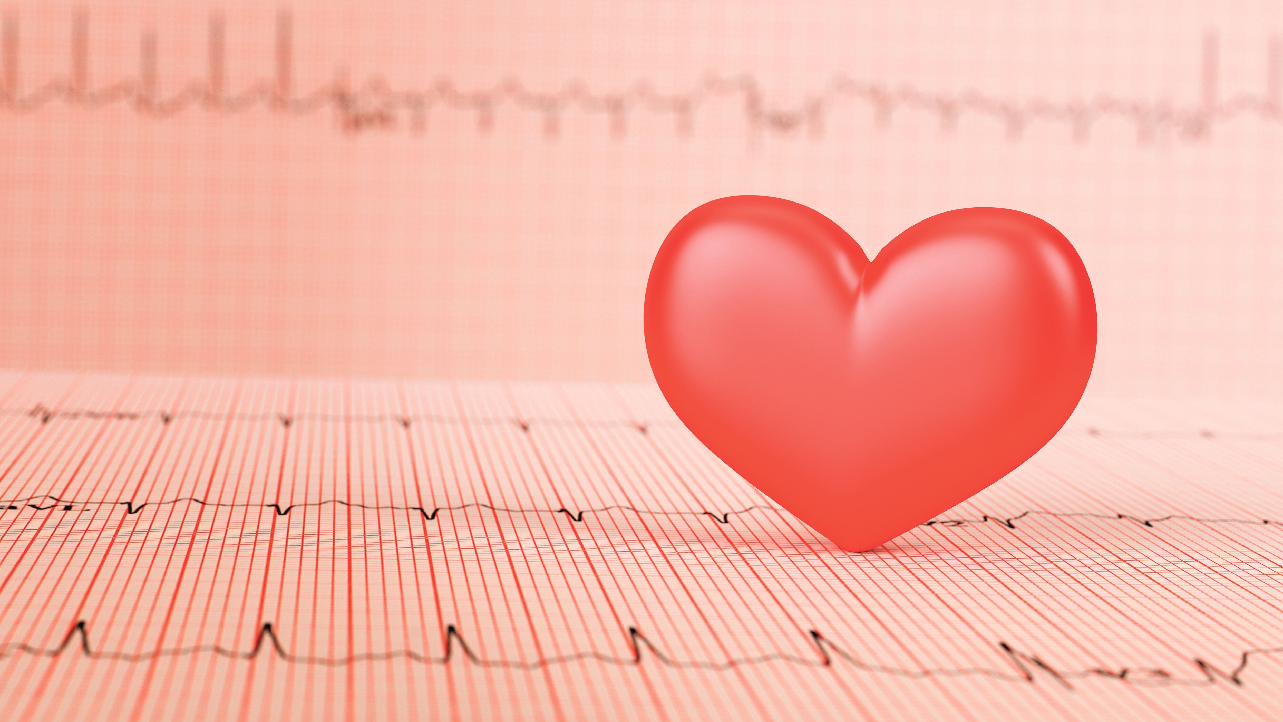 Corazón con prueba de electrocardiograma de fondo.Concepto de salud.Render 3D.