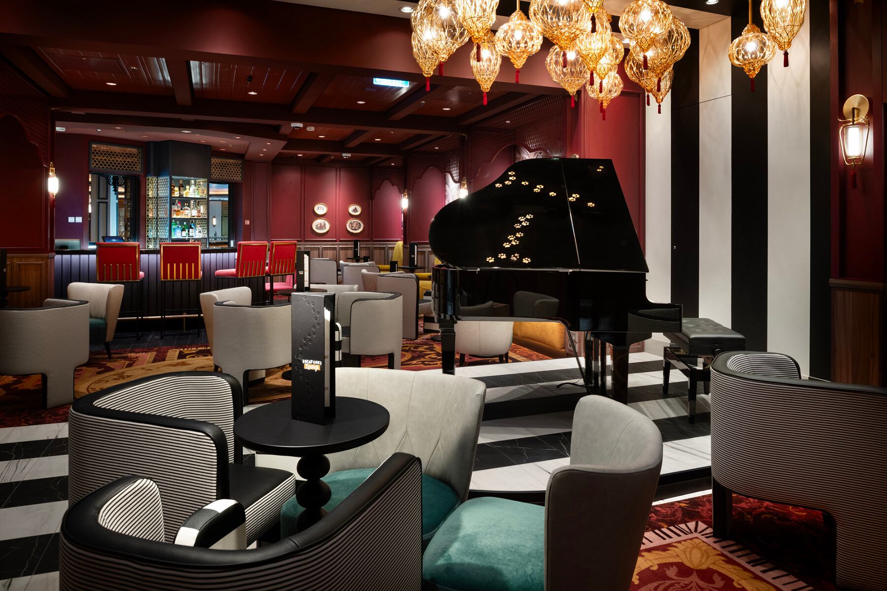 Named for everyone’s favorite music-loving feline from the film, Scat Cat Lounge will bring the groovy penthouse performance of “Ev’rybody Wants to be a Cat” into the real world for the first time aboard the Disney Treasure. The venue combines the elegance of an old-school jazz club with artistic references to “The Aristocats.” Guests will notice a variety of hidden cat details and nods to the classic film, including the paw-covered piano. (Kent Phillips, photographer)