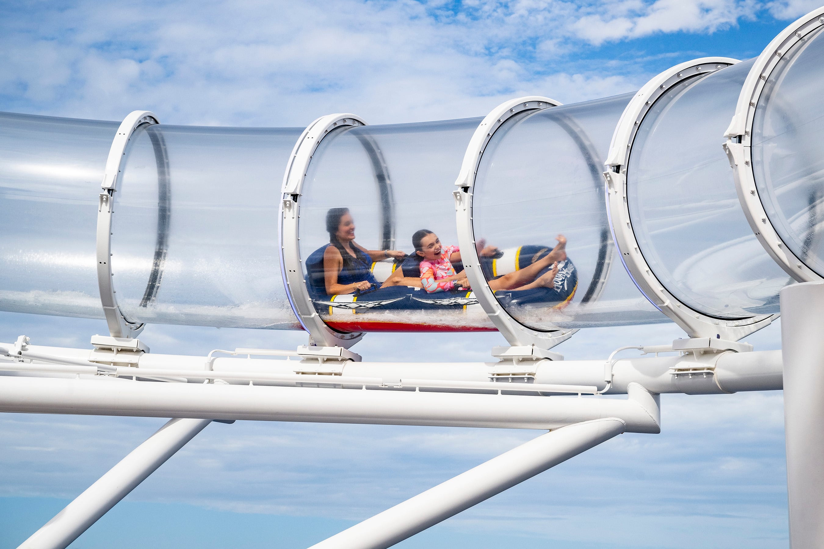 Aboard the Disney Treasure, AquaMouse, Disney Cruise Line’s own attraction at sea, introduces an all-new storyline to its existing lineup that follows Mickey Mouse and Minnie Mouse on a zany misadventure into an ancient temple. Suspended high above the upper decks, powerful jets propel two-person ride vehicles through 760 feet of winding tubes, offering breathtaking views of the ocean and the ship below.