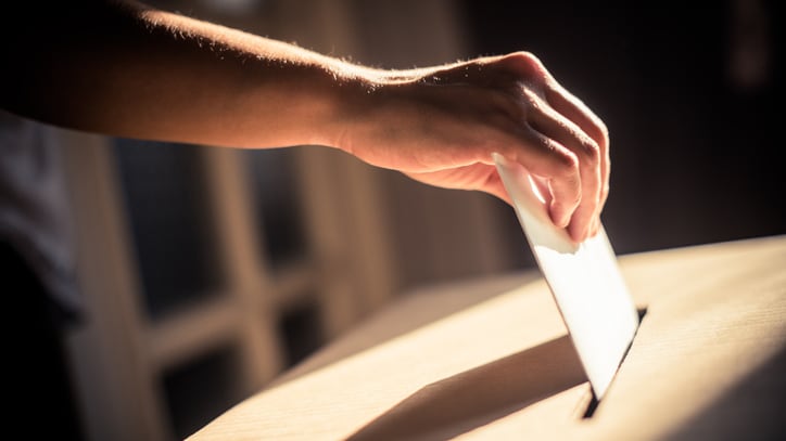 Conceptual image of a person voting during elections