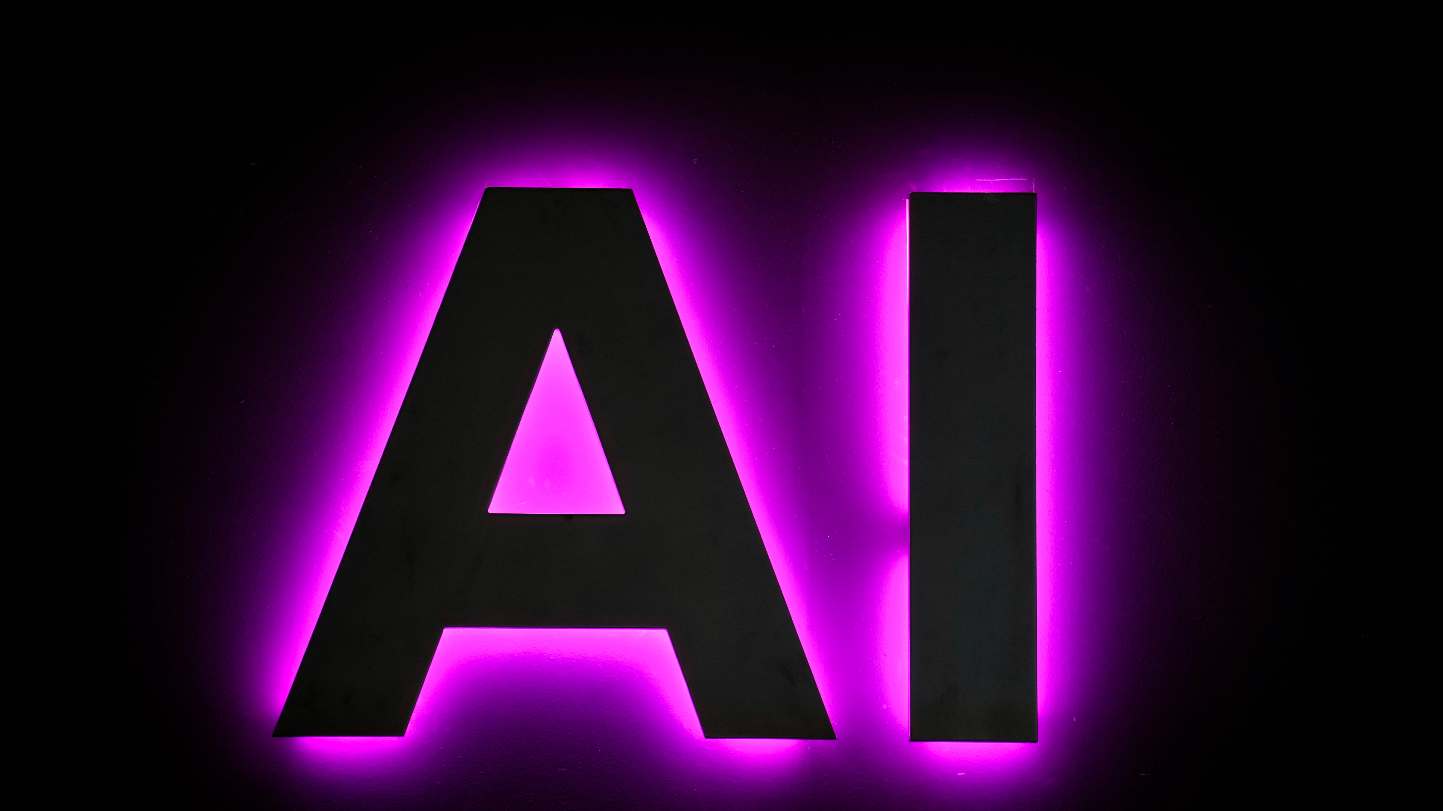 Detalle de un cartel anunciando inteligencia artificial durante una jornada de un MWC, en una imagen de archivo. EFE/Enric Fontcuberta