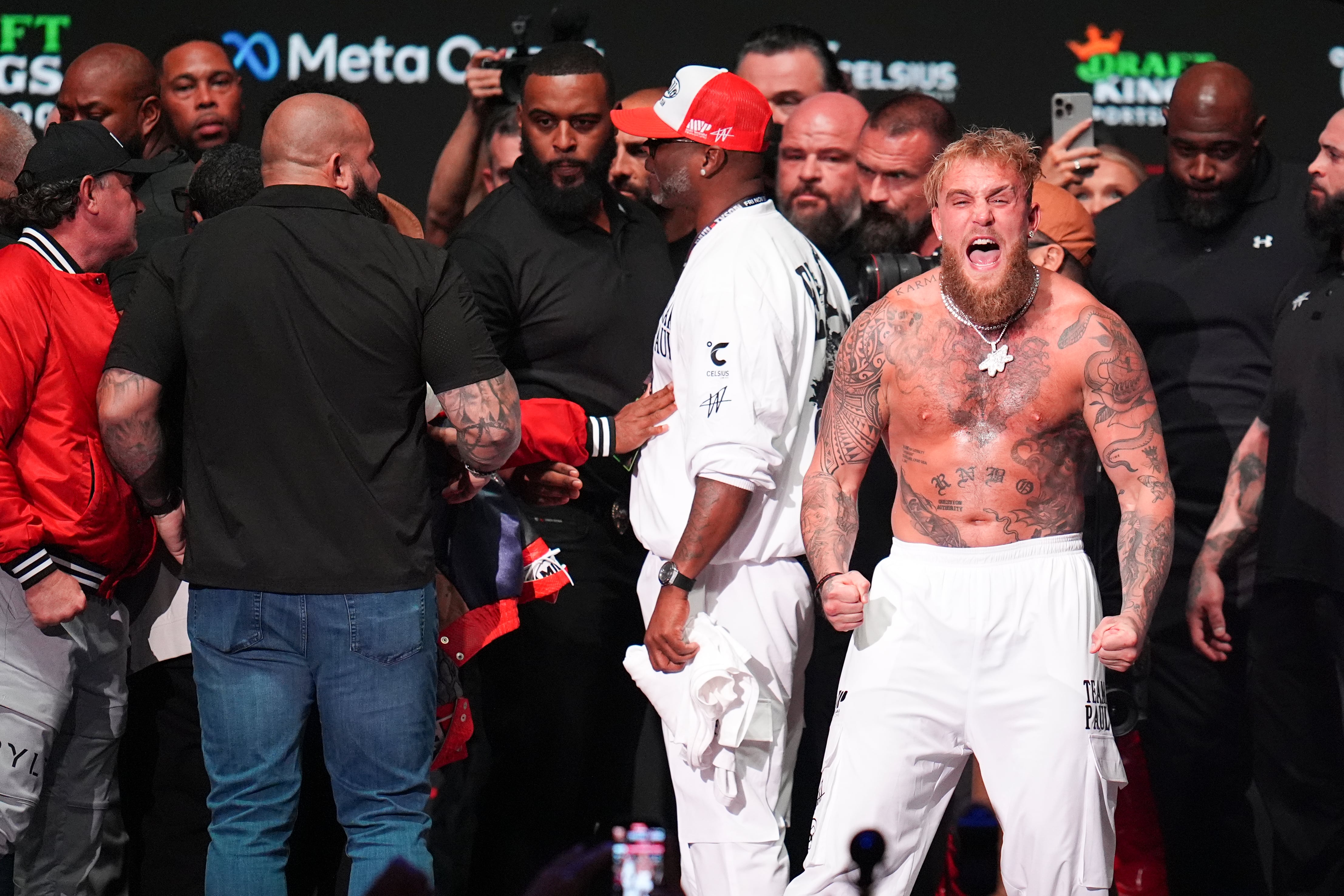 Jake Paul reacts after being slapped by Mike Tyson during a weigh-in ahead of their heavyweight bout, Thursday, Nov. 14, 2024, in Irving, Texas. (AP Photo/Julio Cortez)