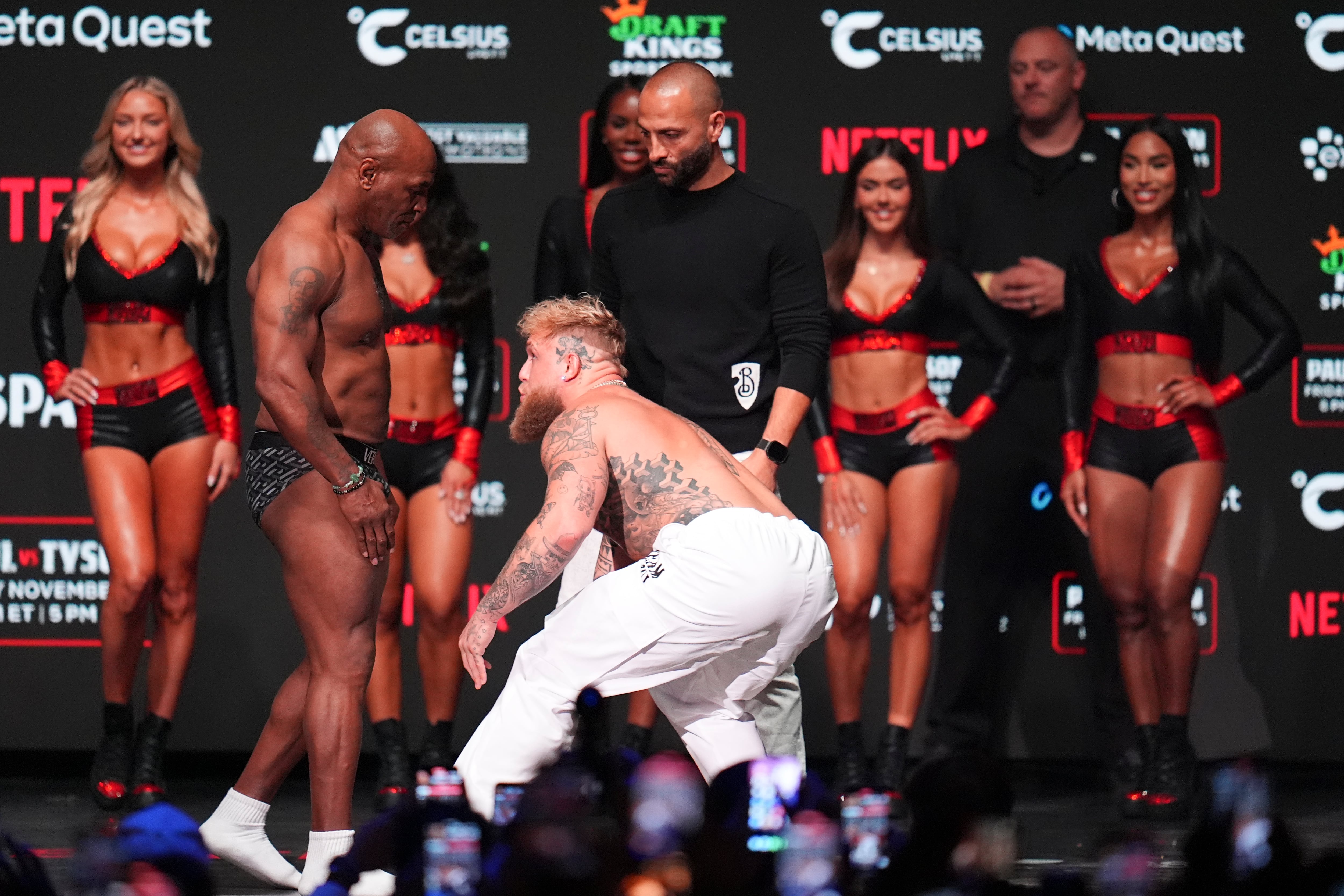 Jake Paul, right, approaches Mike Tyson during a weigh-in ahead of their heavyweight bout, Thursday, Nov. 14, 2024, in Irving, Texas. (AP Photo/Julio Cortez)