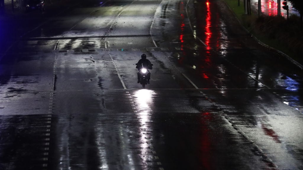 BUENOS AIRES, ARGENTINA - MAY 22: A man rides his motorcycle on Figueroa Alcorta avenue during the first day of the government-imposed lockdown on May 22, 2021 in Buenos Aires, Argentina. President Fernandez announced a national lockdown until May 31 as Argentina undergoes a critical moment due to increase of deaths and cases of COVID. So far, 4.7% of the population has been inoculated and 18.4% has received at least one dose.